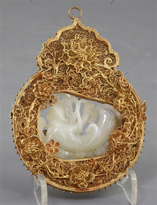 A Chinese pale celadon and russet jade gilt filigree mounted pendant, height 12cm